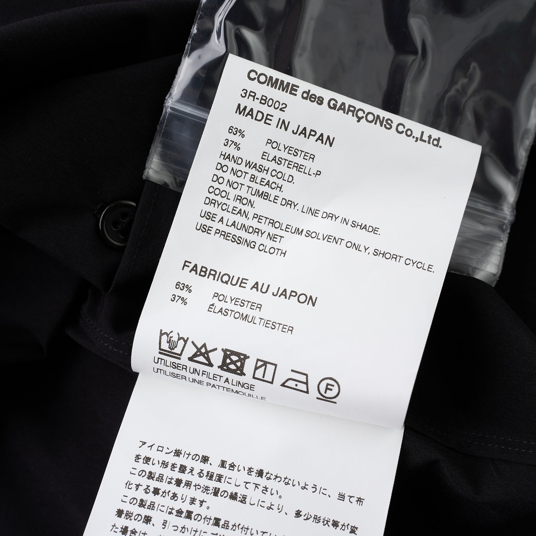 Noir Kei Ninomiya black button-up shirt with band collar, oversized bow with buckle straps across the chest and puffed elbow-length sleeves - view 3