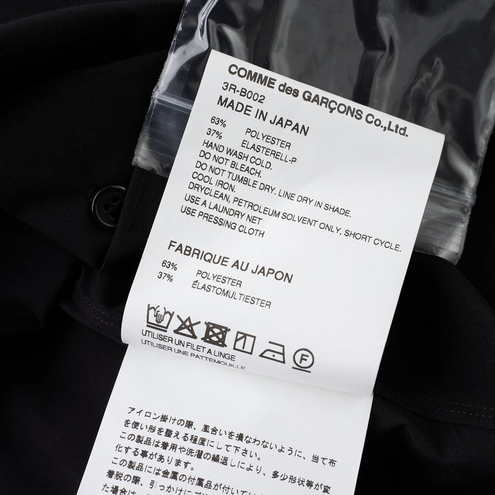 Noir Kei Ninomiya black button-up shirt with band collar, oversized bow with buckle straps across the chest and puffed elbow-length sleeves - view 3