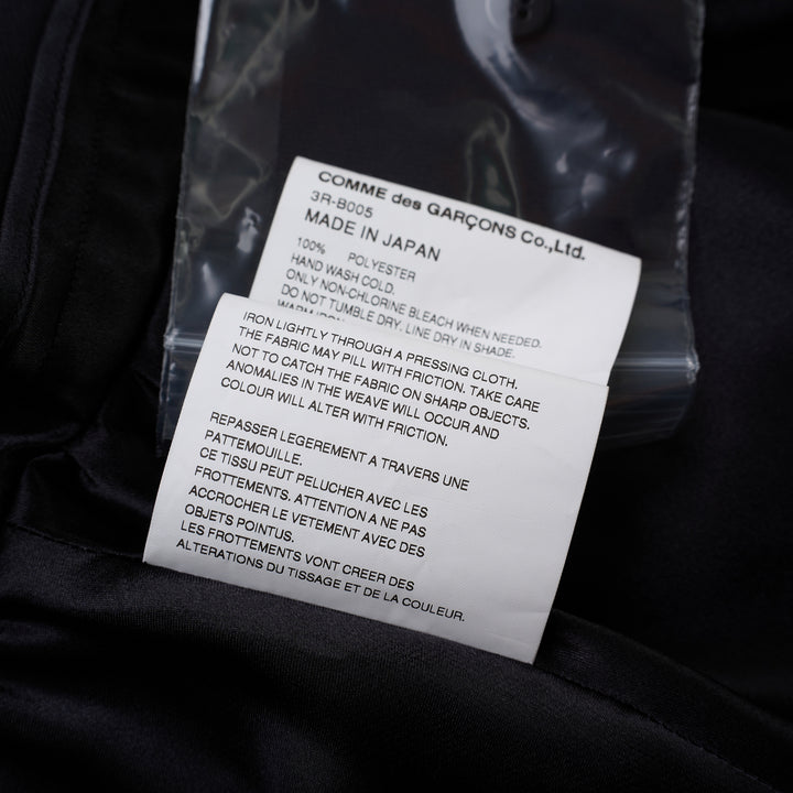 Noir Kei Ninomiya black satin blouse with ruffled stand collar, cascading ruffle placket, long sleeves and tiered peplum hem - view 4
