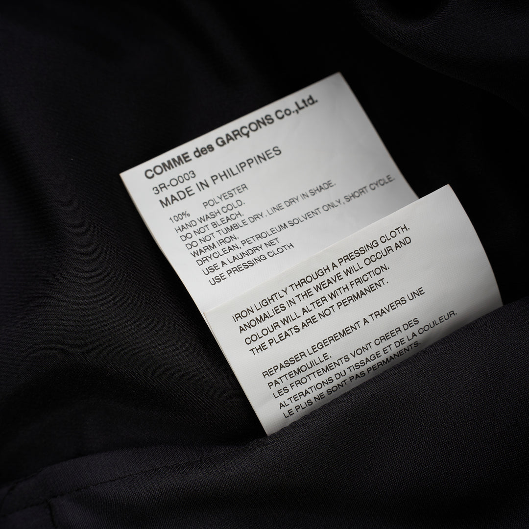 Black polyester satin midi dress with gathered neckline, puff cap sleeves and a pleated ruffle-trimmed tiered hem by Noir Kei Ninomiya - view 4