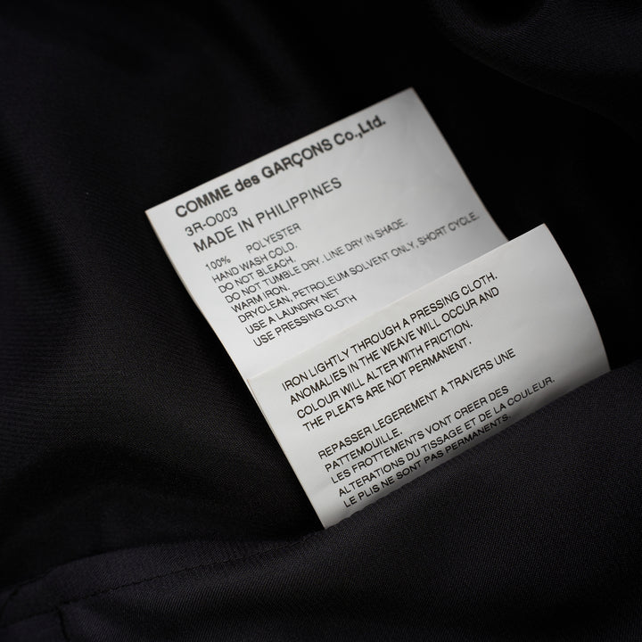 Black polyester satin midi dress with gathered neckline, puff cap sleeves and a pleated ruffle-trimmed tiered hem by Noir Kei Ninomiya - view 4