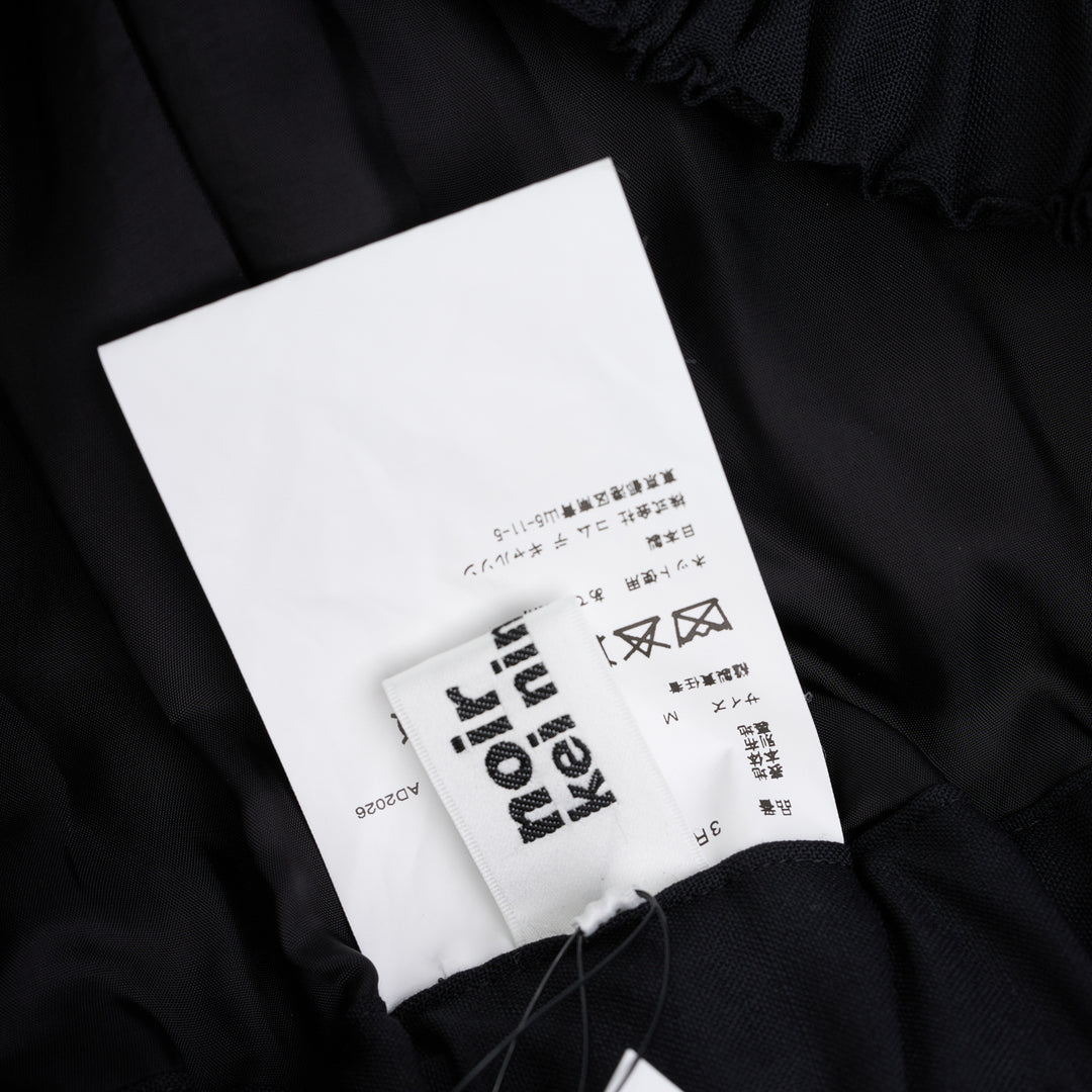 Noir Kei Ninomiya black wool tropical shorts with a stitched flared hem and layered black nylon tulle ruffles - view 3