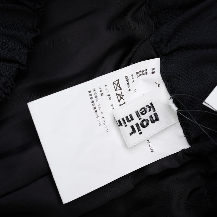 Noir Kei Ninomiya black wool tropical shorts with a stitched flared hem and layered black nylon tulle ruffles - view 5