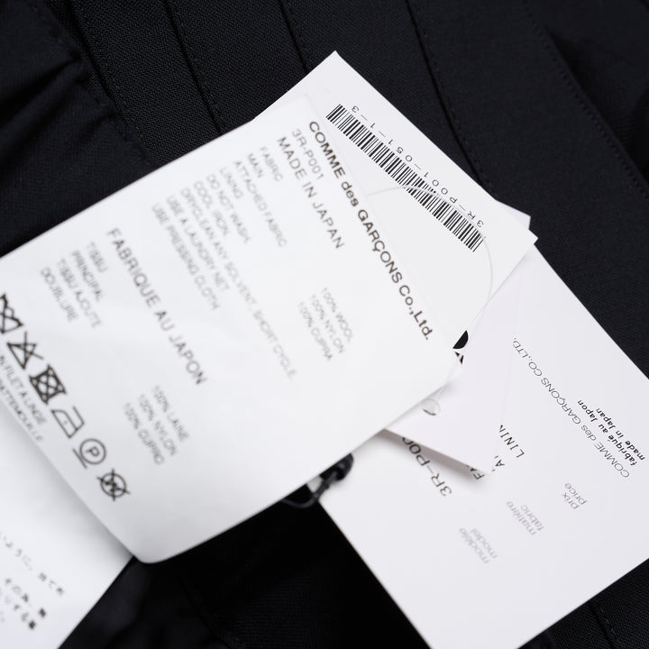 Noir Kei Ninomiya black wool tropical shorts with a stitched flared hem and layered black nylon tulle ruffles - view 6