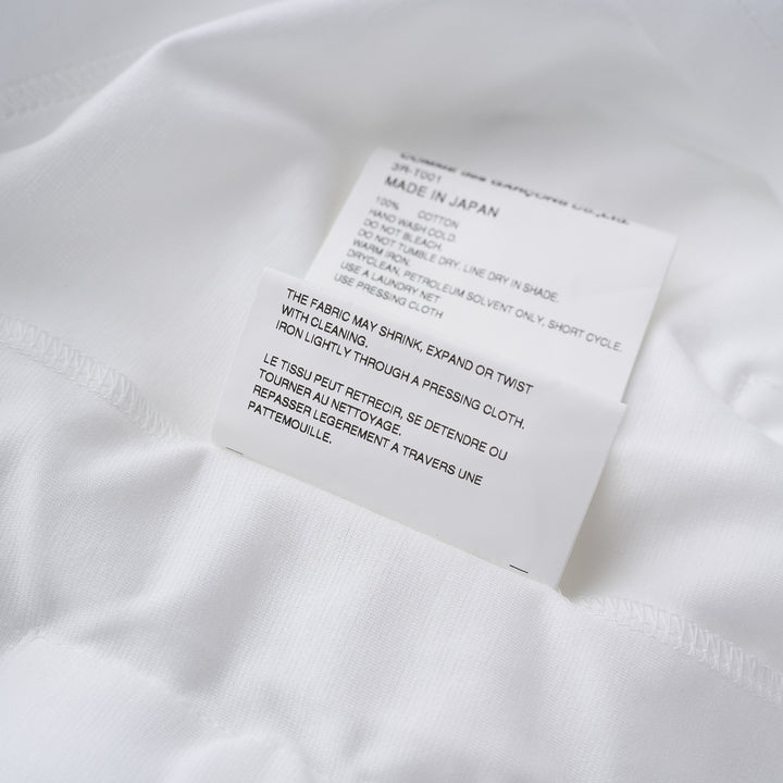 Noir Kei Ninomiya white long-sleeve cotton ponte top with oversized bow details at the hem - view 4