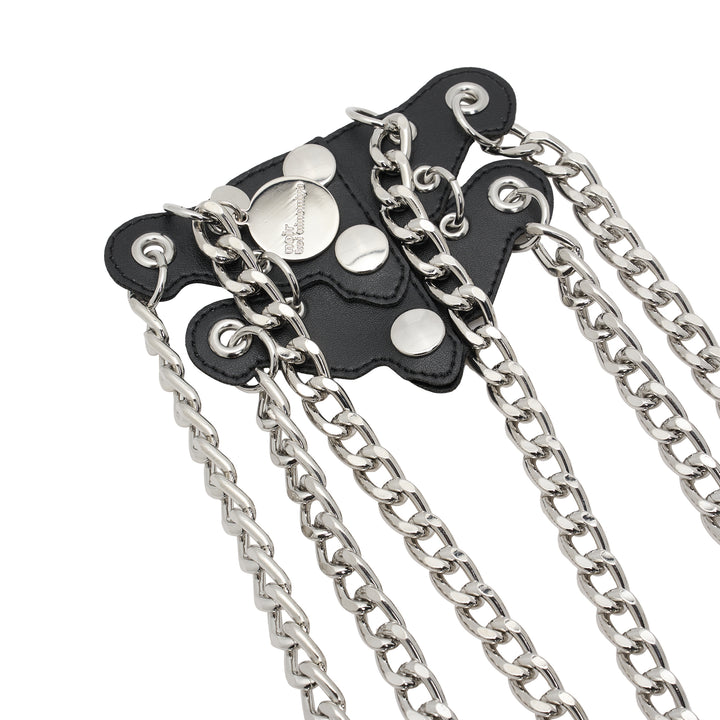 Noir Kei Ninomiya black synthetic leather vest with silver studs, grommets and cascading silver-tone curb chains