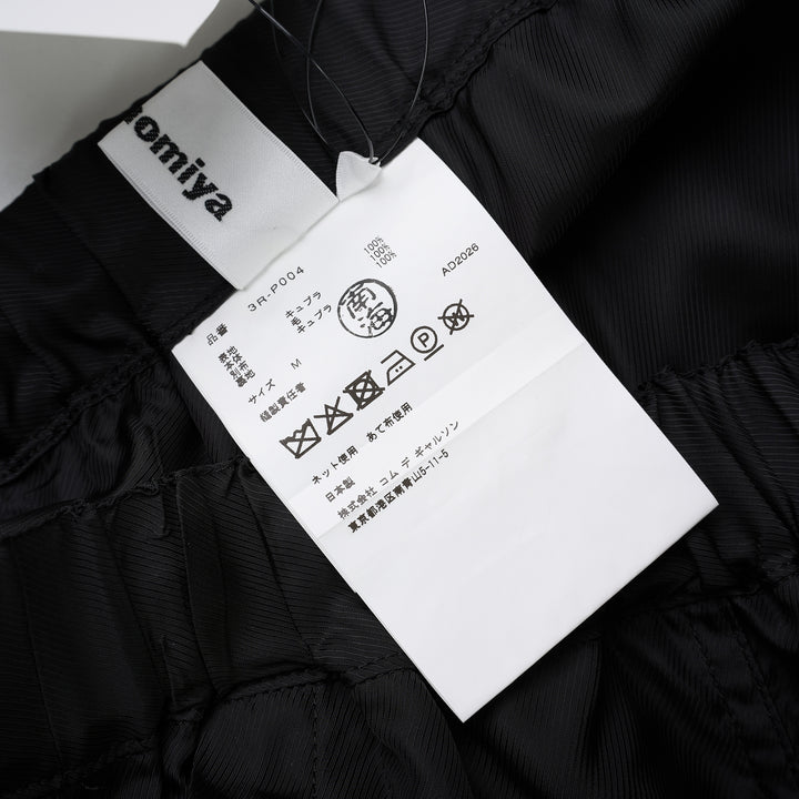 Noir Kei Ninomiya black wide-leg pants in cupra twill and wool gabardine with elasticated waist and layered tailored lower section - view 4