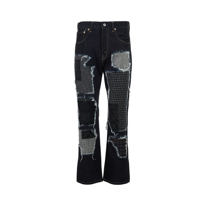 Junya Watanabe dark indigo straight-leg jeans with frayed herringbone, houndstooth and camouflage patchwork panels, front view
