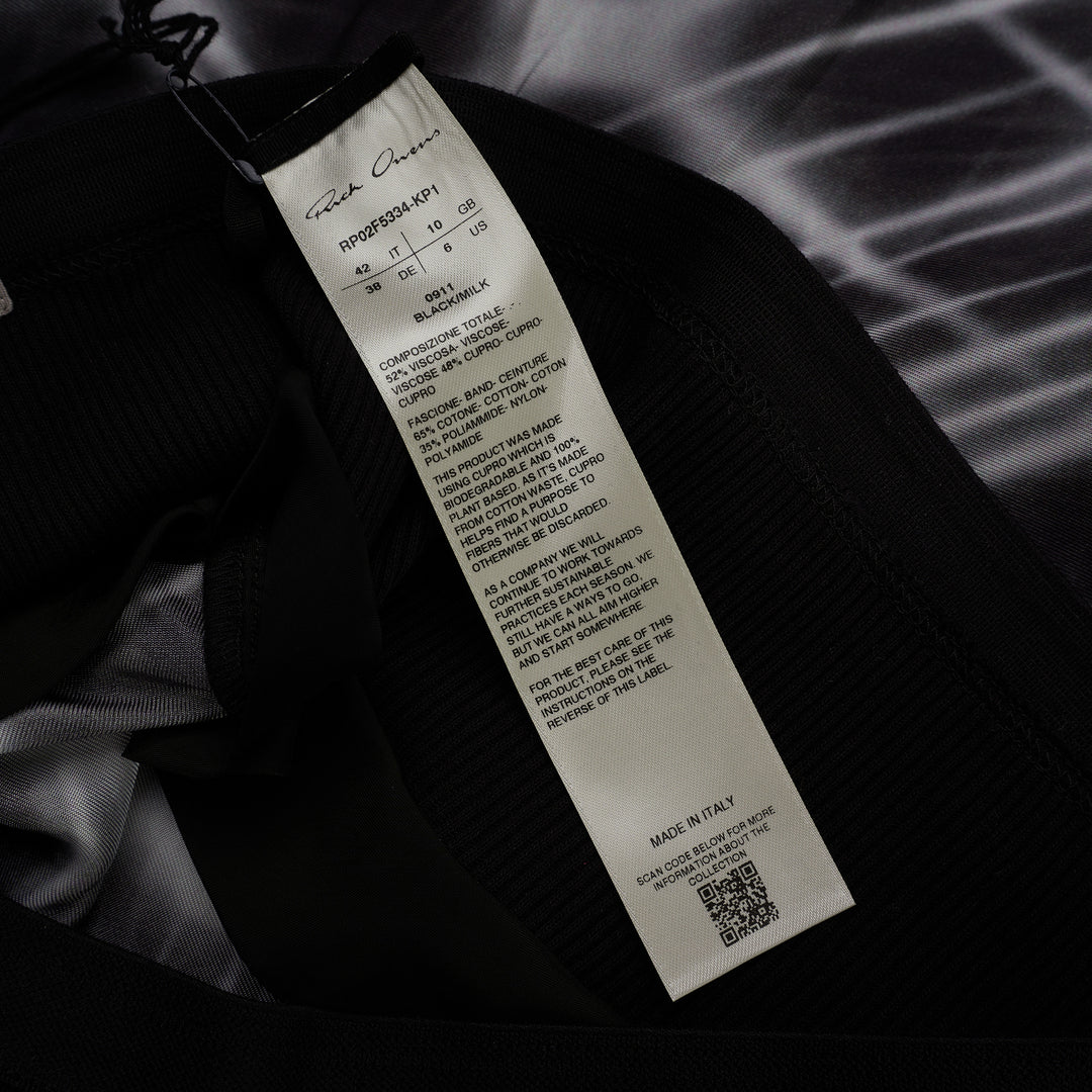 Rick Owens calf-length bias skirt in black with a white starburst print, ribbed black waistband and curved slit at the hem - view 3