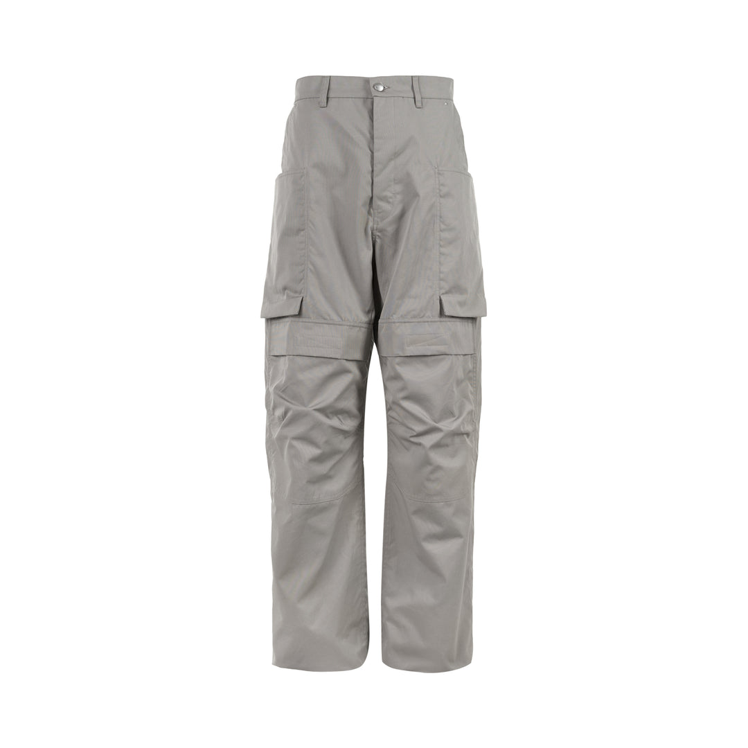 Rick Owens Stefan cargo pants in a grey cotton-nylon ripstop with oversized flap pockets and a wide-leg silhouette, shown from the front