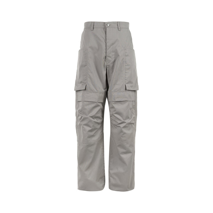 Rick Owens Stefan cargo pants in a grey cotton-nylon ripstop with oversized flap pockets and a wide-leg silhouette, shown from the front