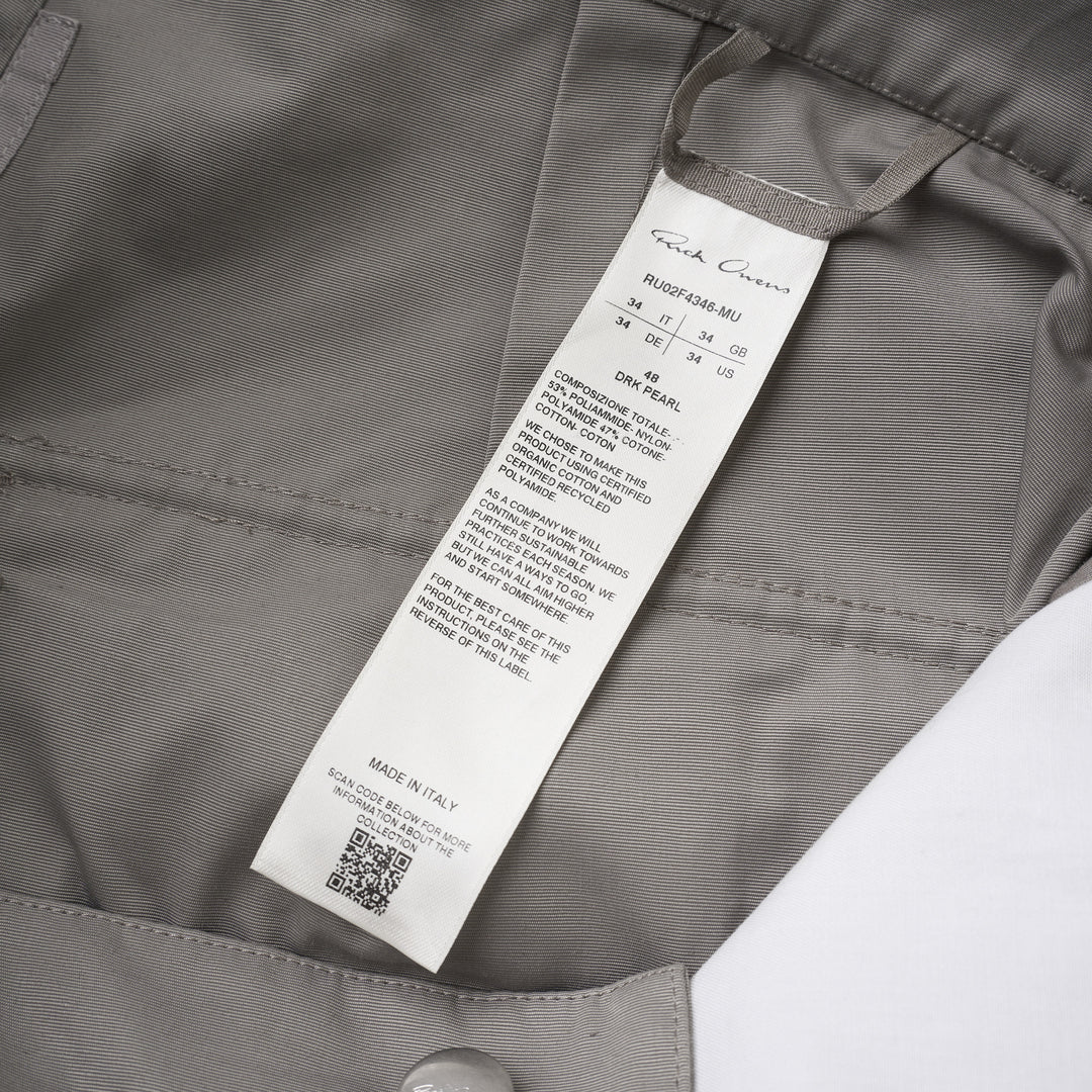 Rick Owens Stefan cargo pants in a grey cotton-nylon ripstop with oversized flap pockets and a wide-leg silhouette, shown from the front - view 3
