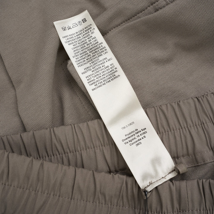 Back view of Rick Owens Mastodon cargo pants in taupe with flap back pockets, side cargo pockets and ribbed cuffs - view 5