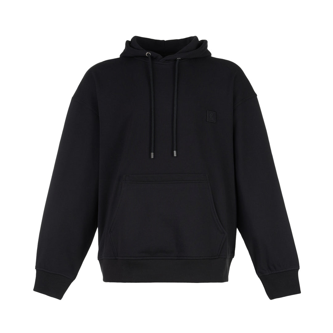 Wooyoungmi black pullover hoodie with drawstring hood, kangaroo pocket and tonal logo patch on the chest