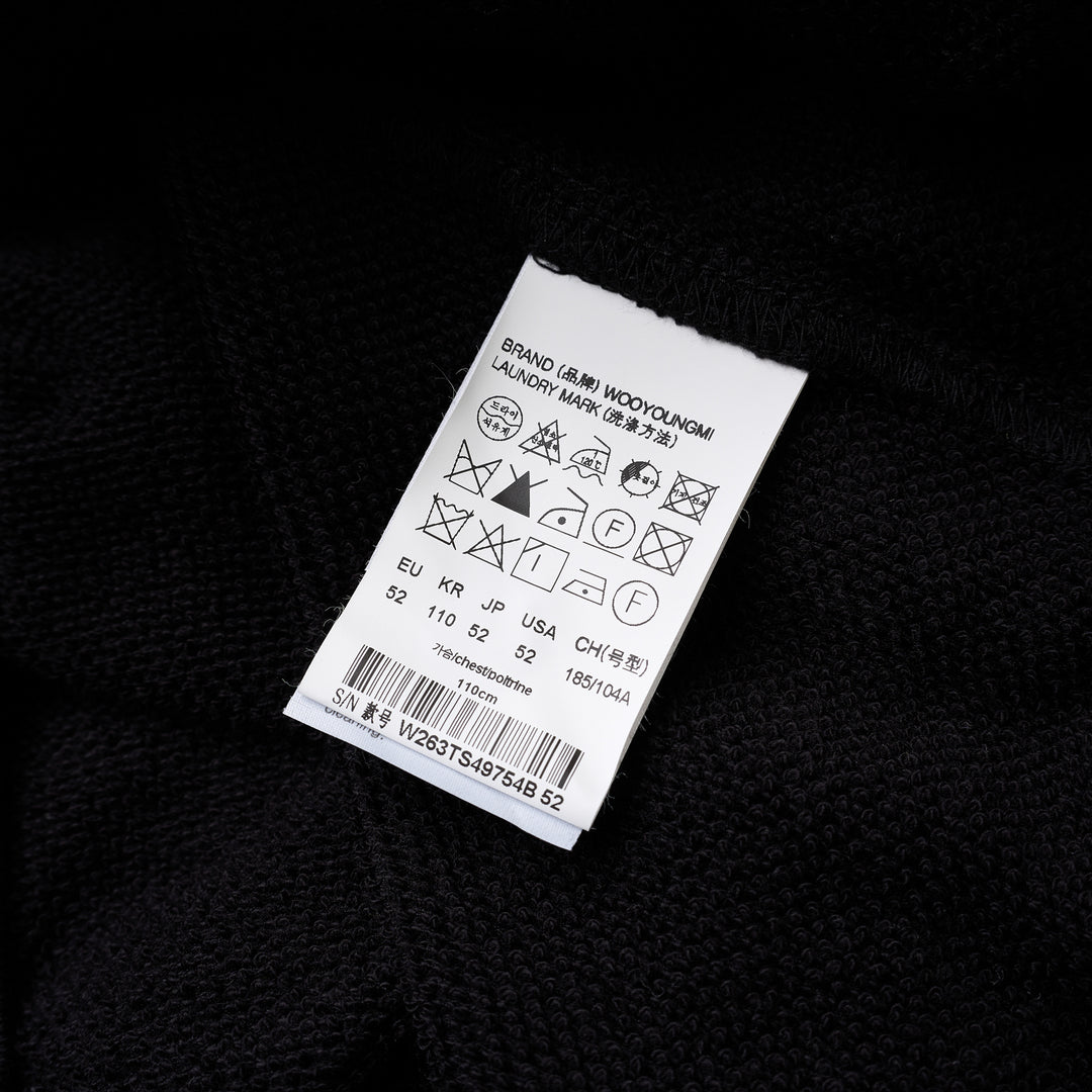 Black Wooyoungmi zip-up hoodie with padlock-style zip pull, stud-detailed kangaroo pockets and small gold logo on the chest - view 3