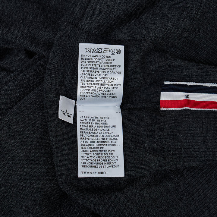 Thom Browne Classic V-Neck Cardigan in light blue with signature 4-Bar white stripe on sleeve and white button front placket