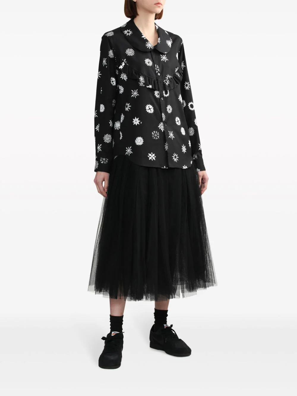 Comme des Garçons BLACK Filip Pagowski print long-sleeve blouse in black with white snowflake motifs, ruffle bib detail, and peter pan collar