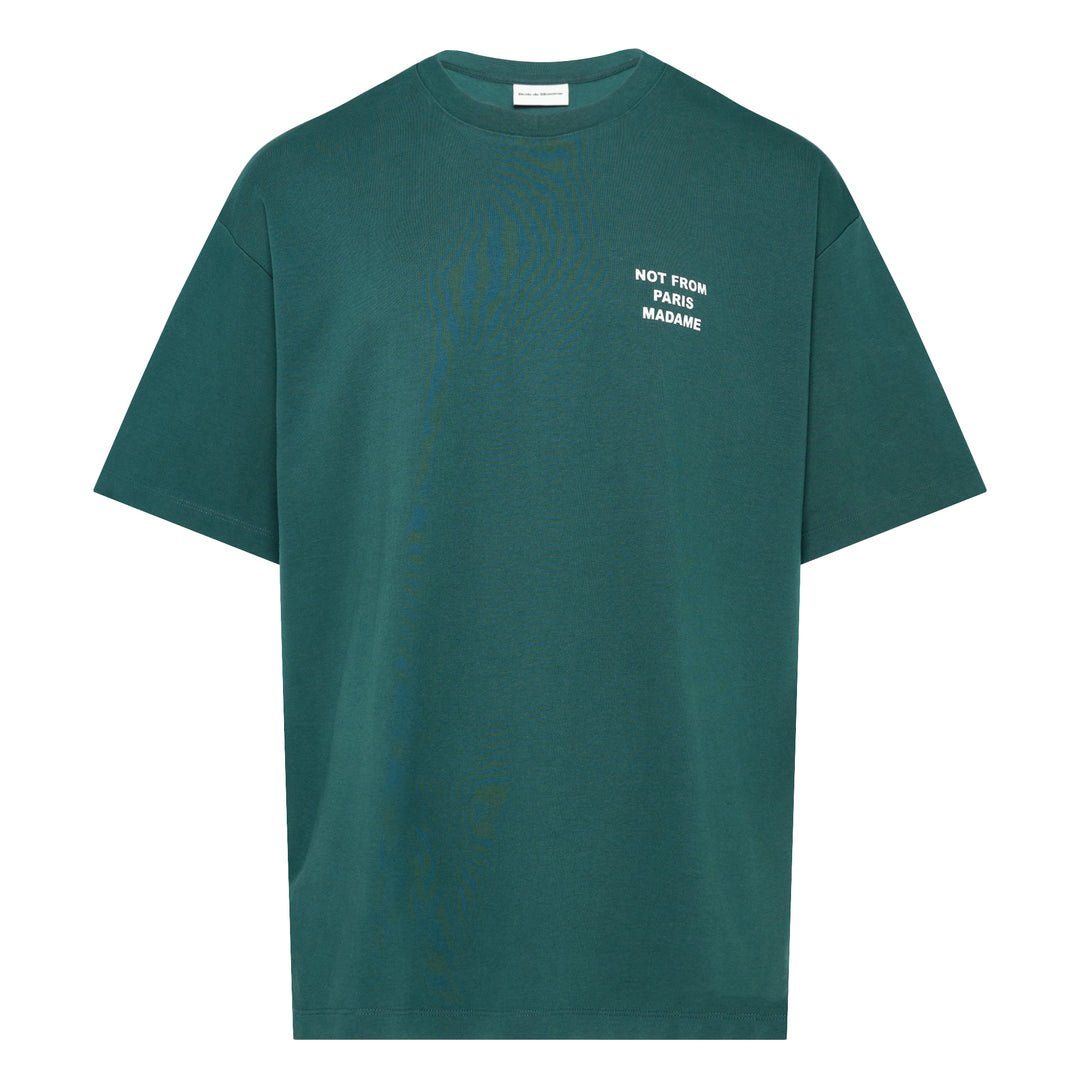 Drôle de Monsieur Not From Paris Madame slogan tee in forest green with white chest print, oversized fit, crew neck