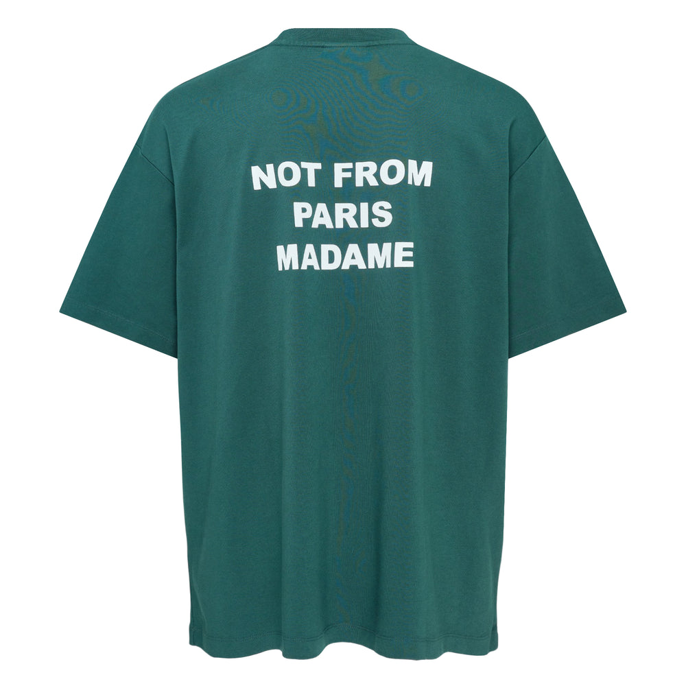 Drôle de Monsieur Not From Paris Madame slogan tee in forest green with white chest print, oversized fit, crew neck