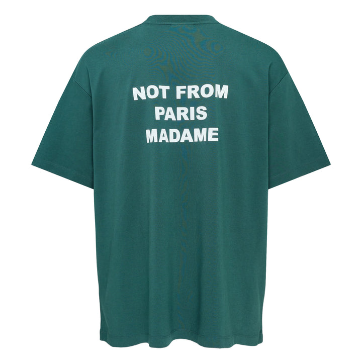 Drôle de Monsieur Not From Paris Madame slogan tee in forest green with white chest print, oversized fit, crew neck