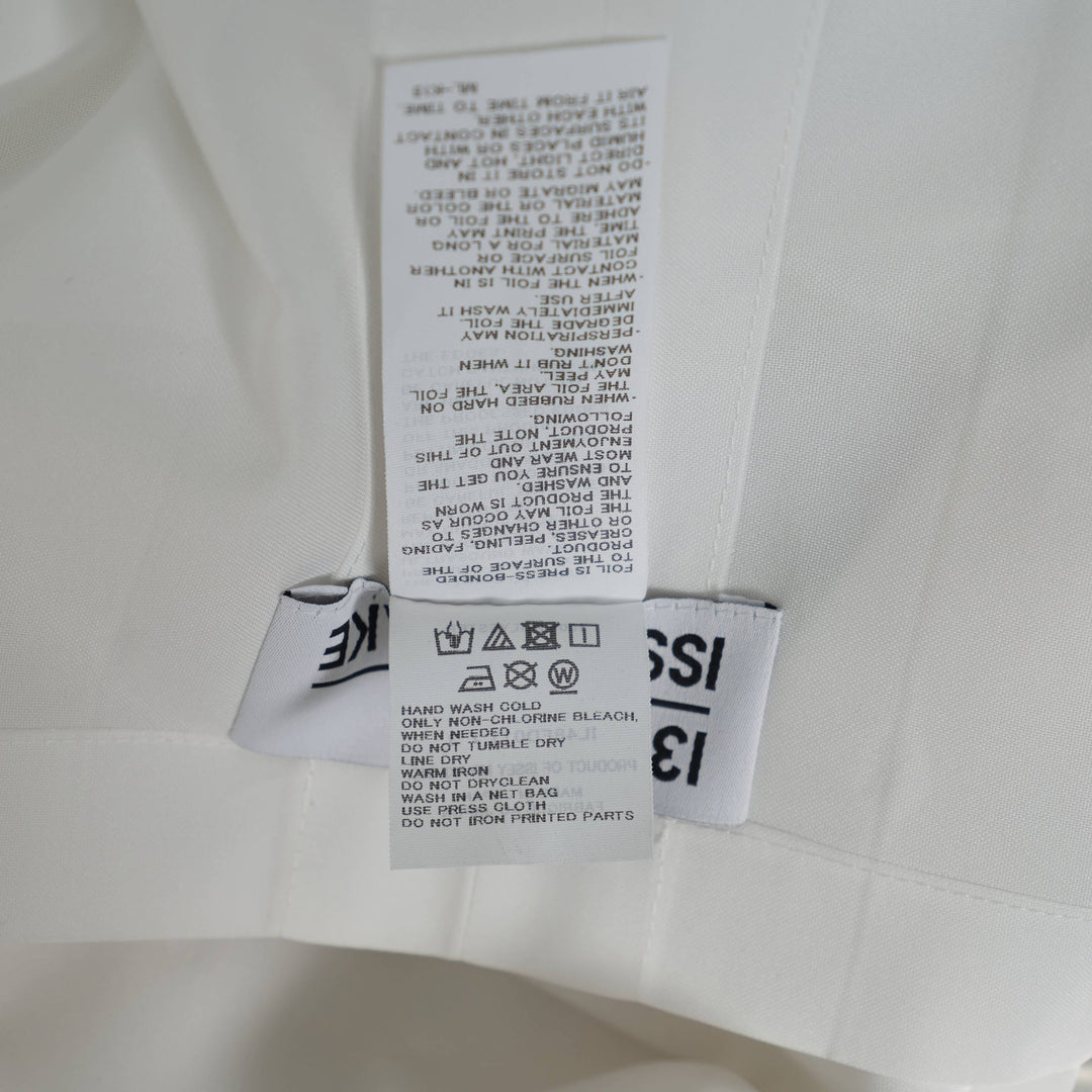 132 5. Issey Miyake white origami pleated standard jacket with geometric angular panels and ruffled three-quarter sleeves, front view