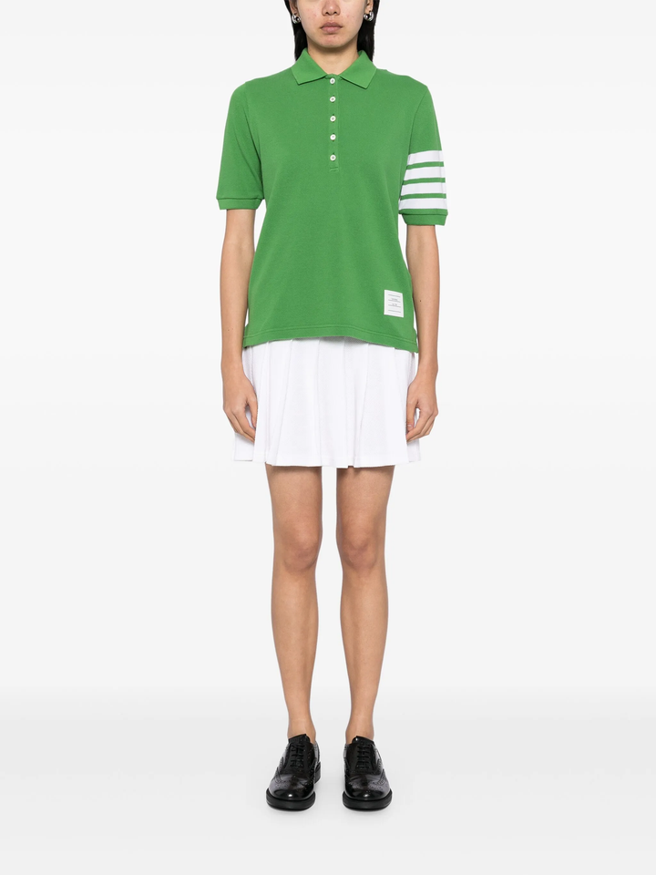 Thom Browne light blue short sleeve piqué polo shirt with white 4-bar stripe on sleeve and tri-colour hem trim, made in Italy