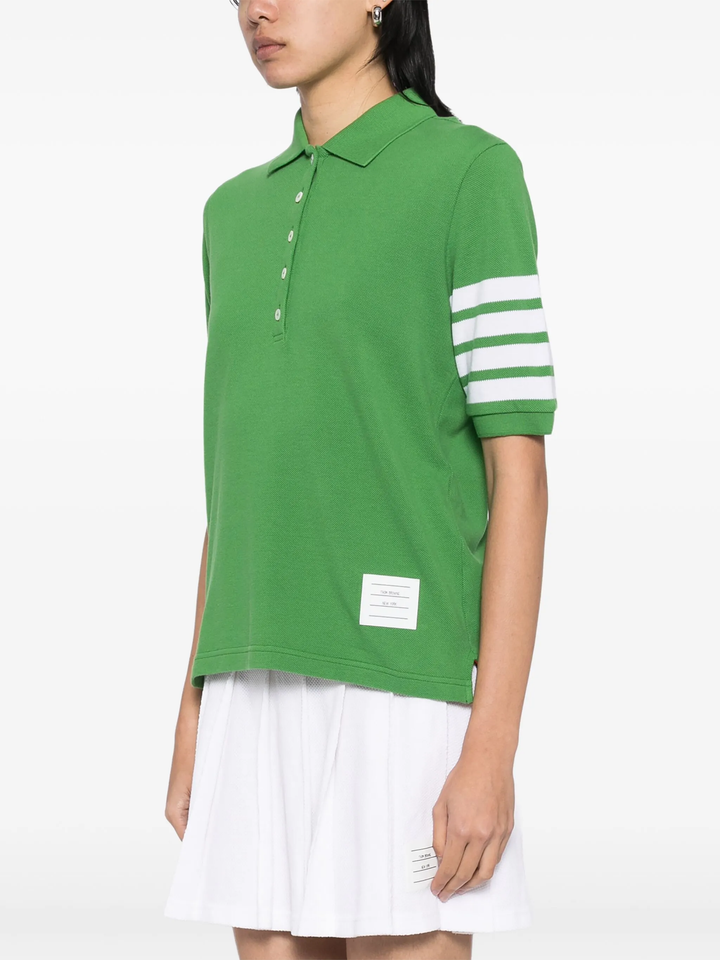 Thom Browne light blue short sleeve piqué polo shirt with white 4-bar stripe on sleeve and tri-colour hem trim, made in Italy