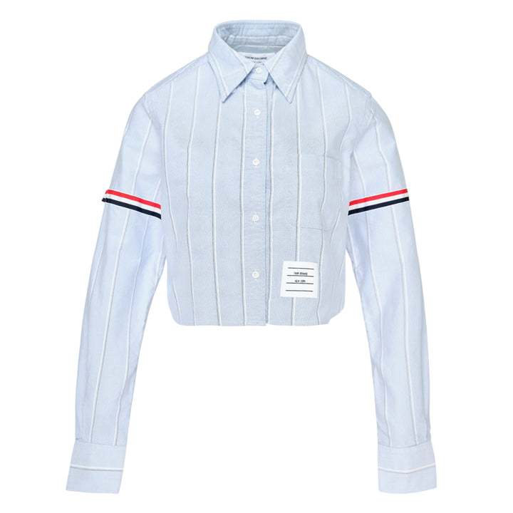 Thom Browne white pinstripe oxford cropped shirt with red, white and black grosgrain armband stripe on the sleeve and button-down collar