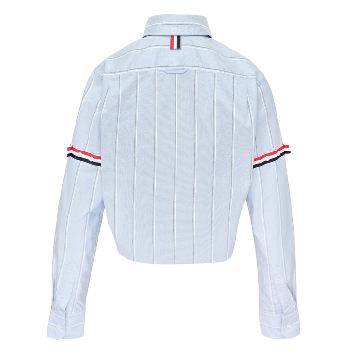 Thom Browne white pinstripe oxford cropped shirt with red, white and black grosgrain armband stripe on the sleeve and button-down collar