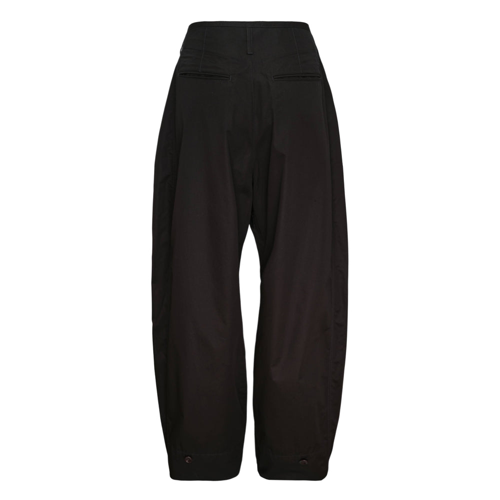 Lemaire Soft Volume Pants in black — high-waisted barrel-leg silhouette with pleated volume, tapered cuffs, and snap-button hem detail, displayed flat on white background