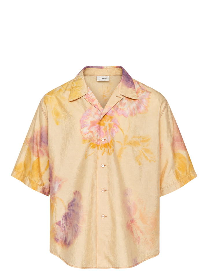 Lemaire short sleeve summer shirt in silk with a blurred watercolour floral print in yellow, pink and violet, shown with an open camp collar and button front