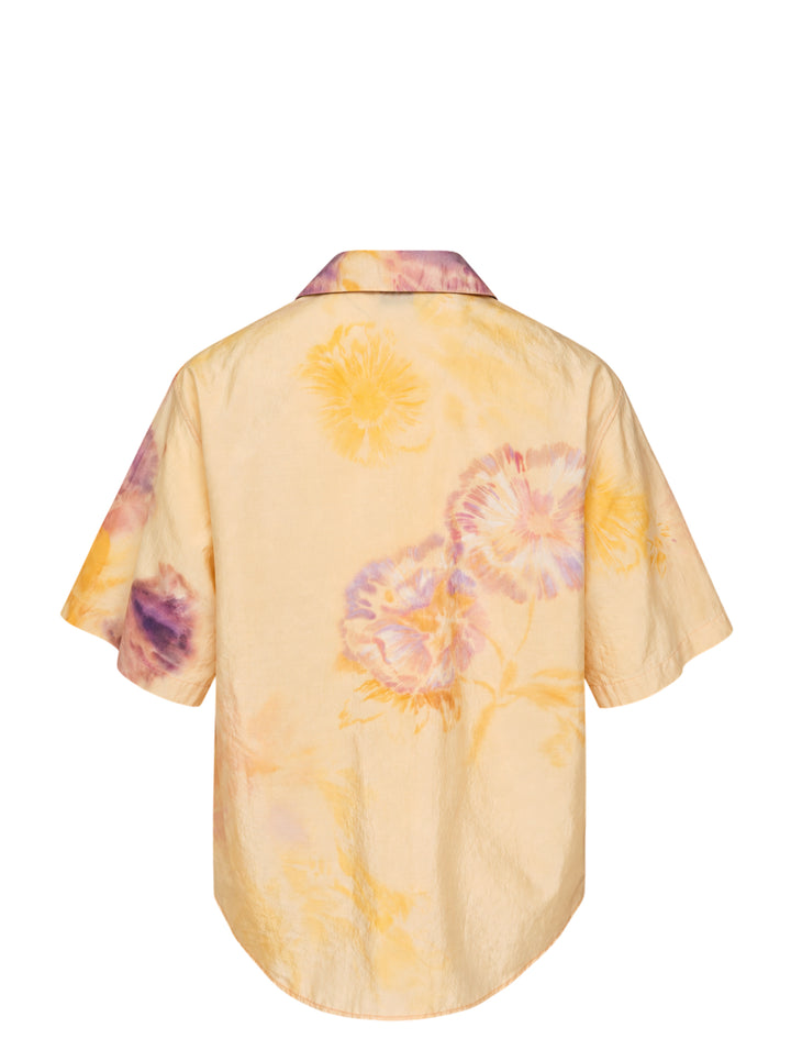 Lemaire short sleeve summer shirt in silk with a blurred watercolour floral print in yellow, pink and violet, shown with an open camp collar and button front - view 2