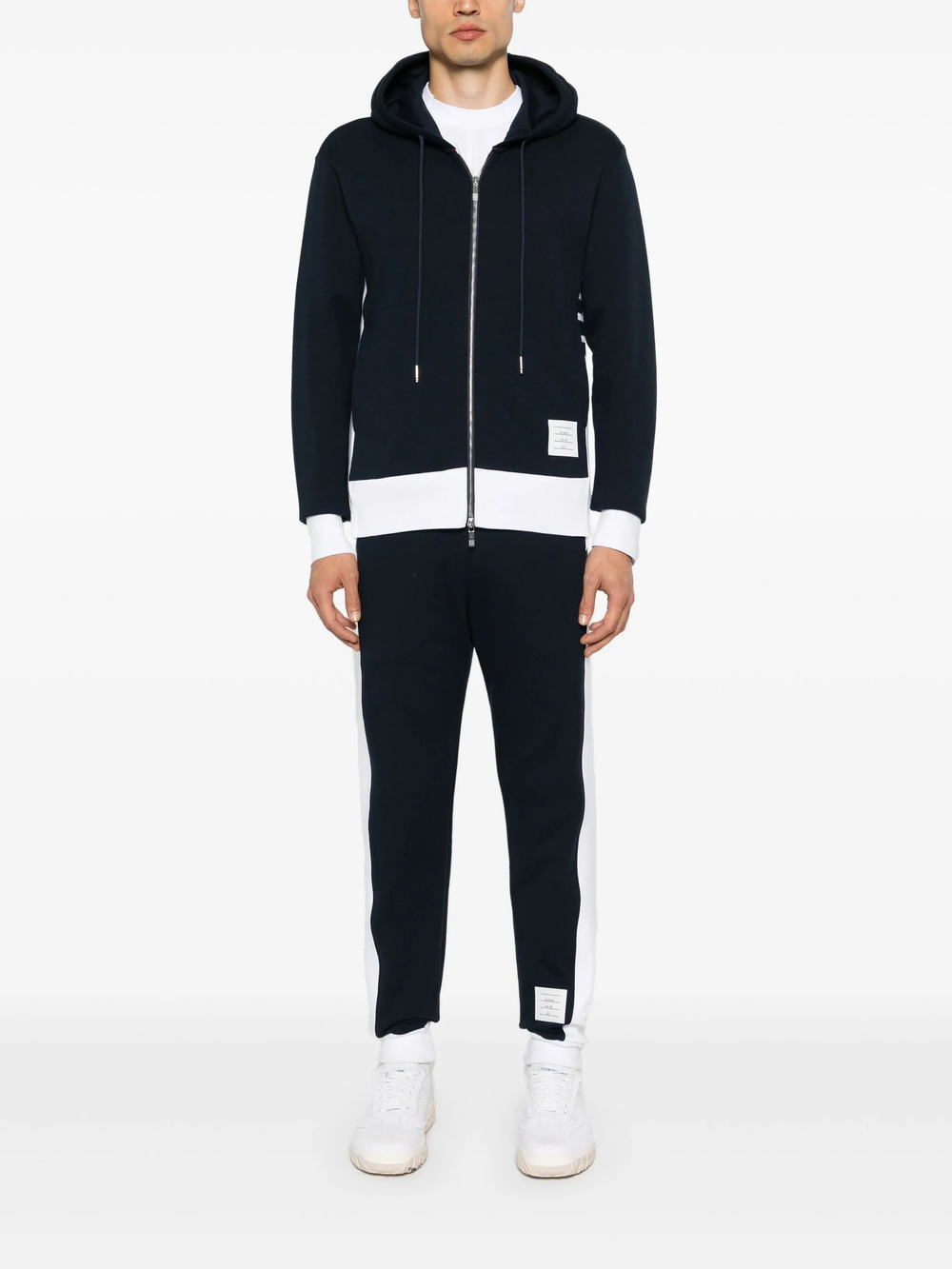 Thom Browne 4-Bar Jersey Zip Hoodie in navy with white contrast hem, silver zip, and signature stripe sleeve detail
