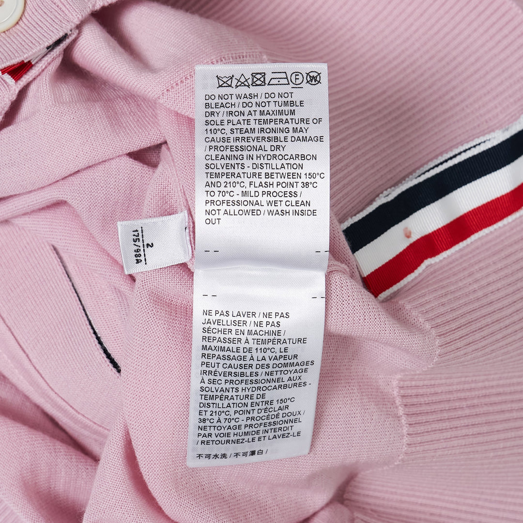Thom Browne Classic V-Neck Cardigan in light blue with signature 4-Bar white stripe on sleeve and white button front placket