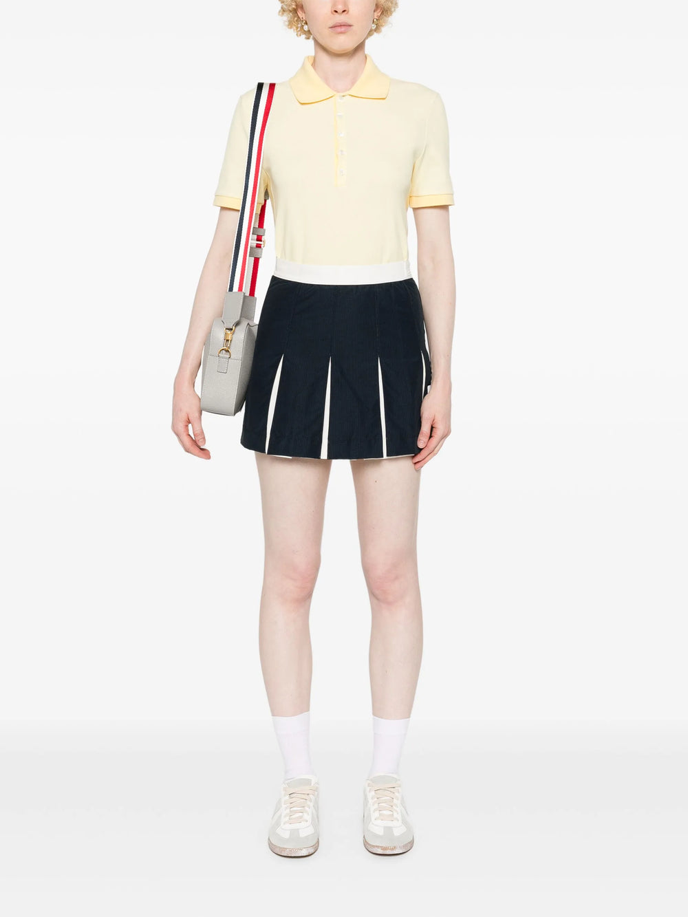 Thom Browne Short Sleeve Rib Cuff Polo in light blue piqué cotton with spread collar, four-button placket and signature stripe grosgrain tab