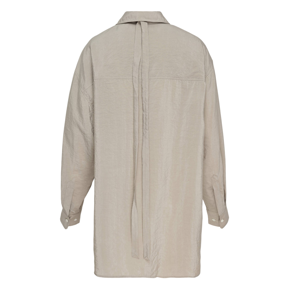 Lemaire Long Shirt with Tie in greige, featuring an oversized silhouette, pointed collar, mother-of-pearl buttons, and crinkled fabric texture — front view on white background