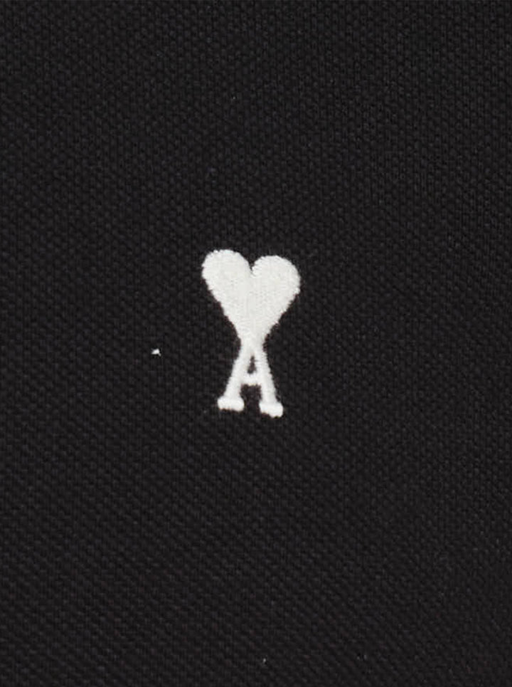 Ami Alexandre Mattiussi black piqué polo shirt with white Ami de Cœur logo embroidery on the chest and a two-button placket, front view - view 3