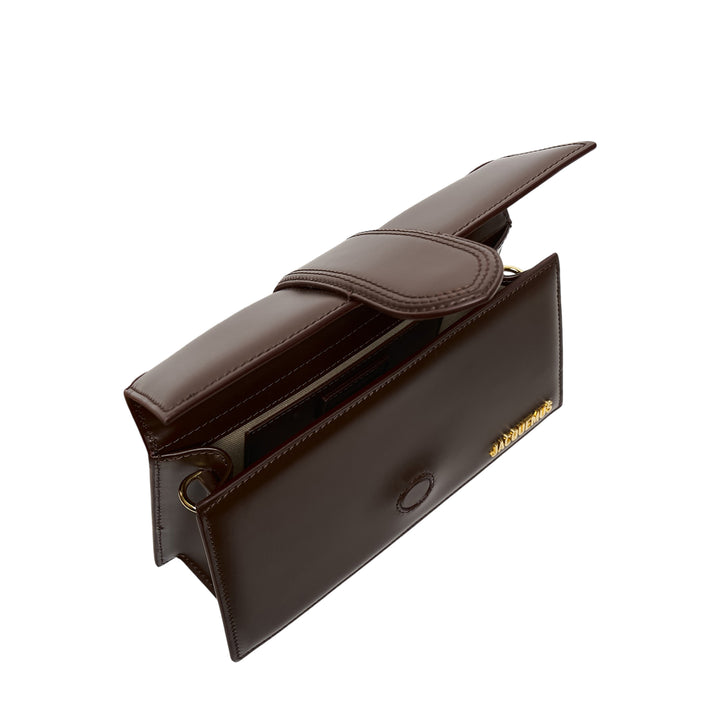 Jacquemus Le Grand Bambino smooth dark brown leather shoulder bag with adjustable crossbody strap, curved top handle, central flap tab closure, and gold-tone hardware and branding - view 3