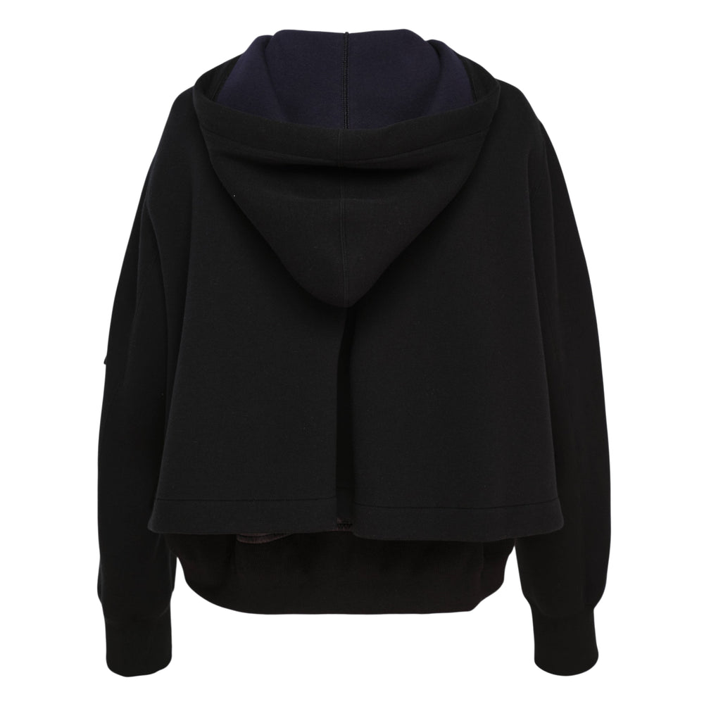 sacai Sponge Sweat x Nylon Twill Hoodie in navy blue with olive green cargo pocket panels, silver full-length zip, and orange lining detail