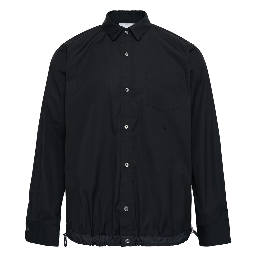 sacai Cotton Poplin Shirt in black with contrast nylon elasticated drawstring hem, silver-tone buttons, and chest patch pocket
