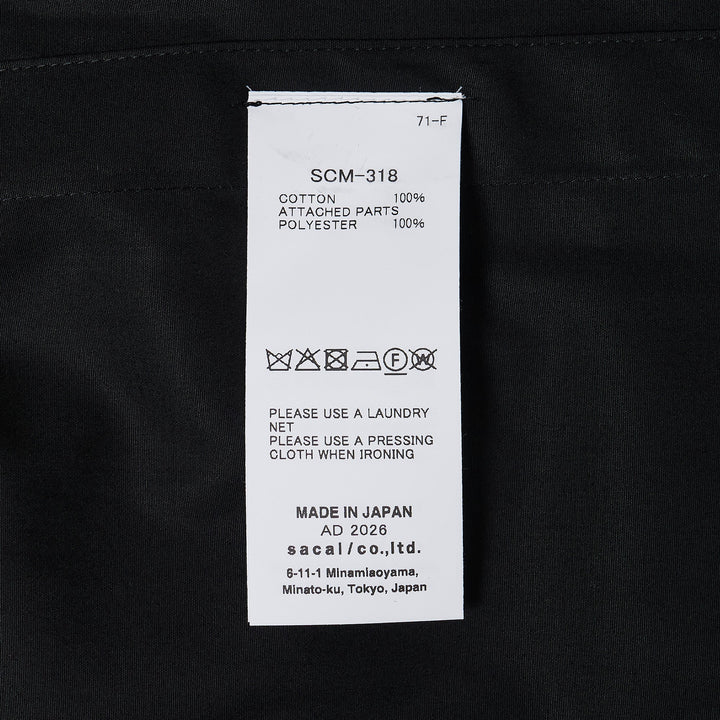 sacai Cotton Poplin Shirt in black with contrast nylon elasticated drawstring hem, silver-tone buttons, and chest patch pocket