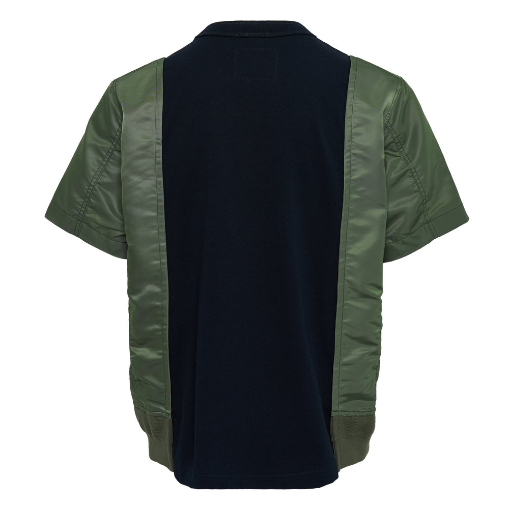 sacai Nylon Twill x Cotton Jersey Tee in black and olive green, featuring MA-1 bomber nylon sleeves and side panels with snap-tab details