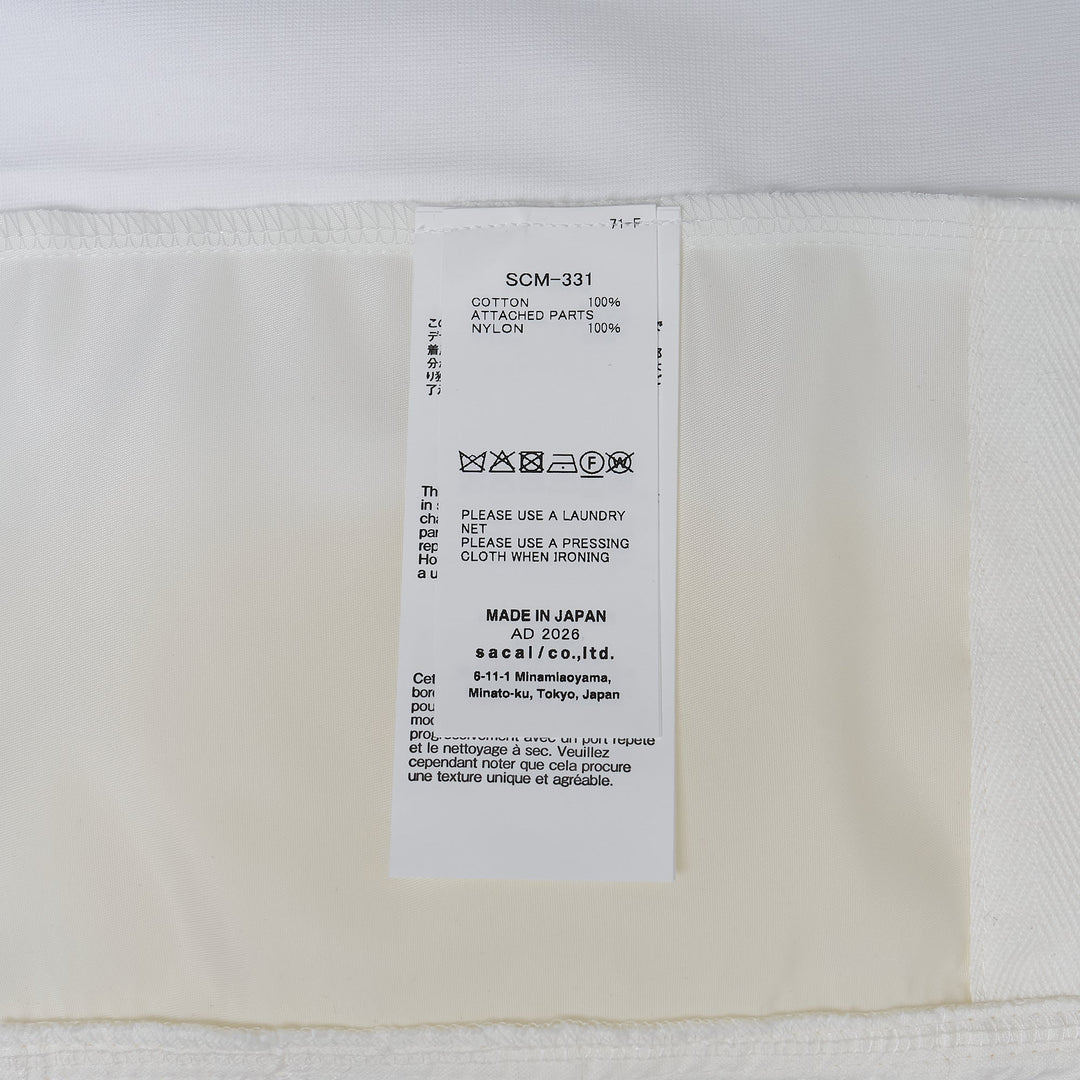 sacai Nylon Twill x Cotton Jersey T-Shirt in white with chest pocket and contrast nylon twill side panels, oversized relaxed fit