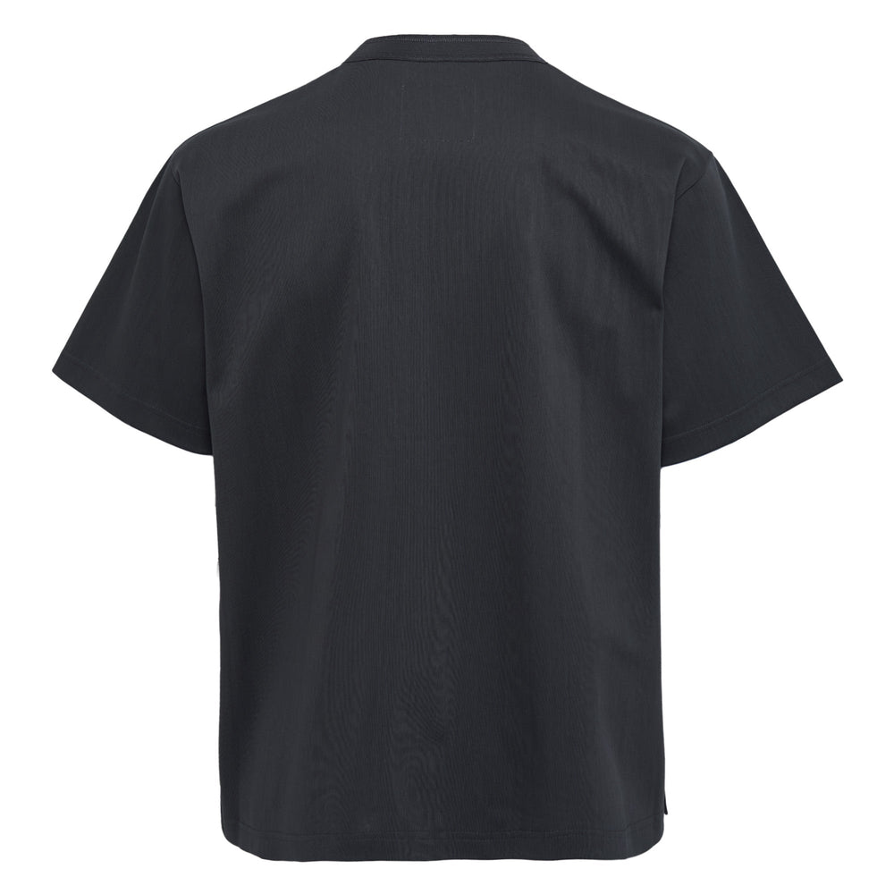 sacai Cotton Jersey T-Shirt in dark charcoal with gold embroidered 'S' logo on chest pocket, relaxed boxy fit and ribbed crew neck