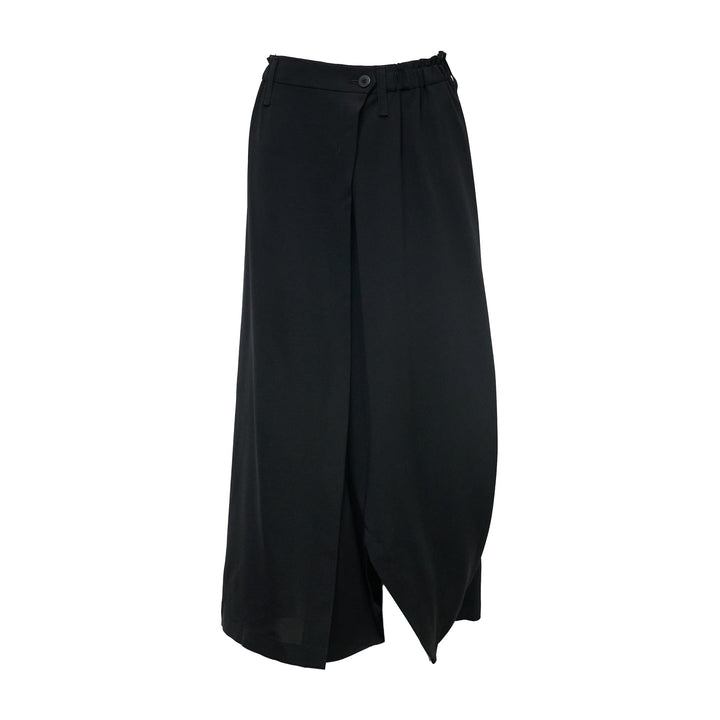 132 5. Issey Miyake Seamless Basic Woven Pants in black, featuring a wide-leg silhouette, wrap-style front panel, and dual drawstring and button waistband