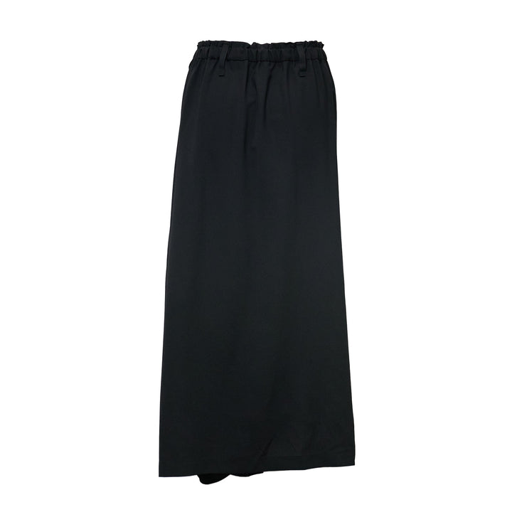 132 5. Issey Miyake Seamless Basic Woven Pants in black, featuring a wide-leg silhouette, wrap-style front panel, and dual drawstring and button waistband