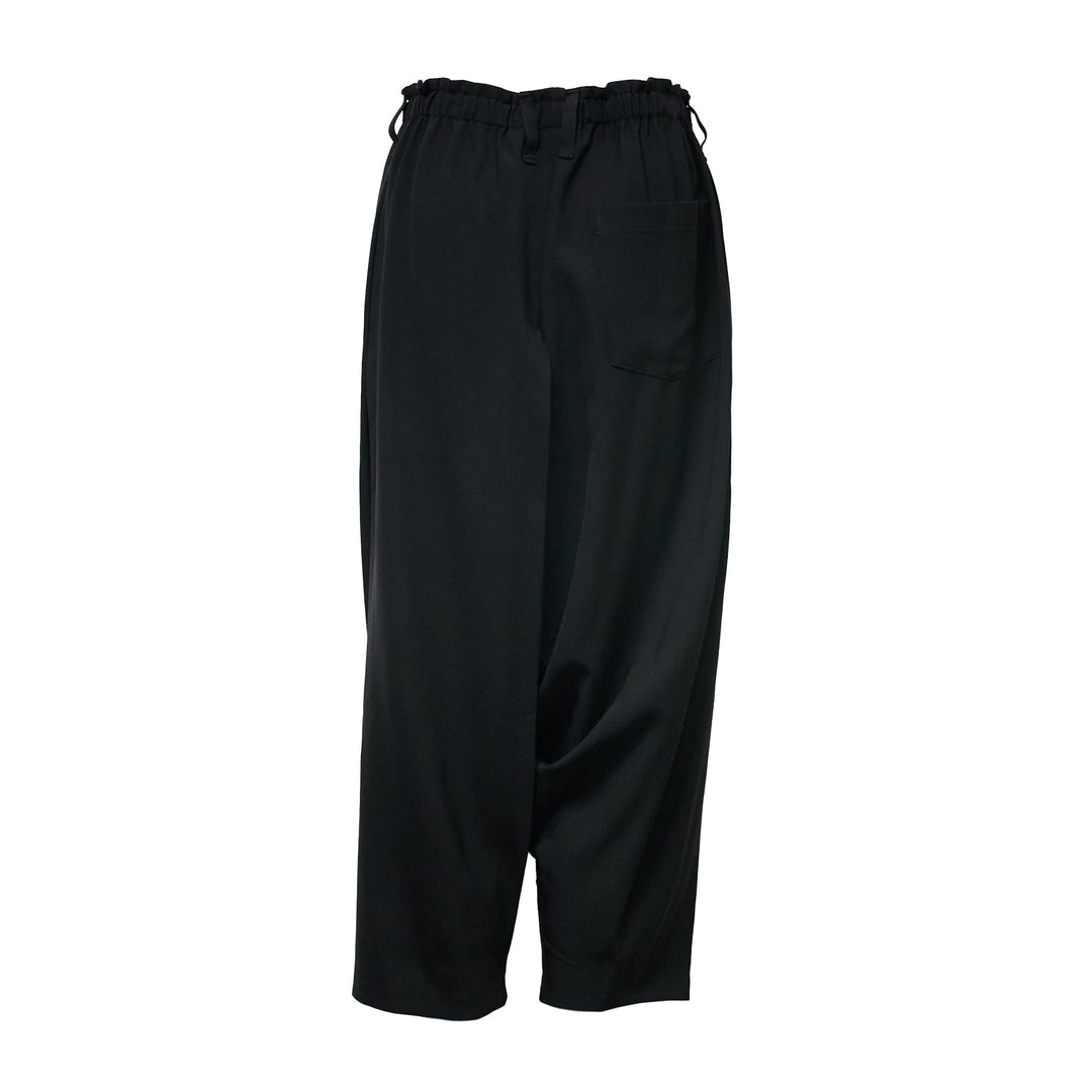 132 5. Issey Miyake black seamless woven drop crotch pants with elasticated drawstring waistband and cropped wide-leg silhouette