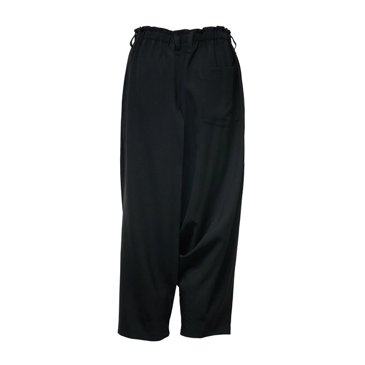 132 5. Issey Miyake black seamless woven drop crotch pants with elasticated drawstring waistband and cropped wide-leg silhouette