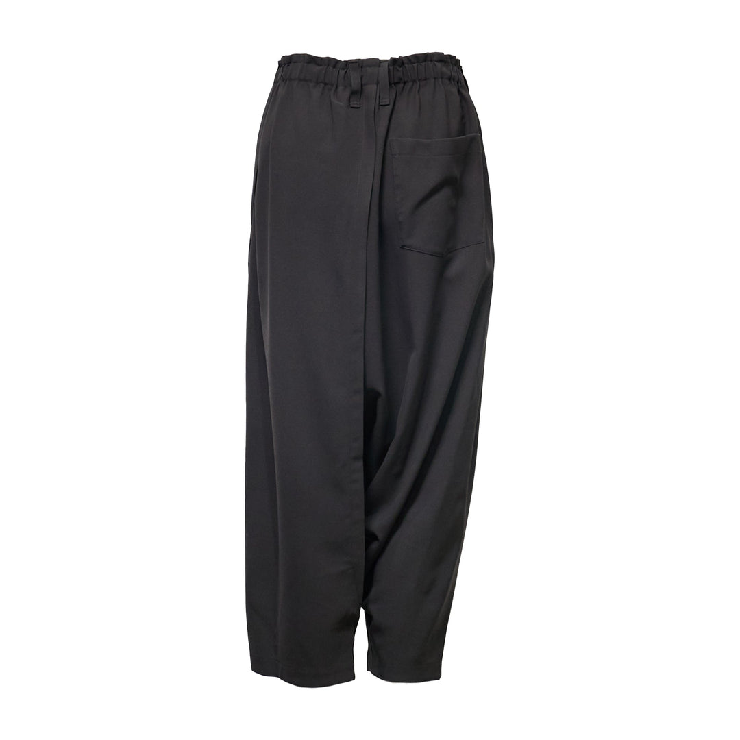 132 5. Issey Miyake black seamless woven drop crotch pants with elasticated drawstring waistband and cropped wide-leg silhouette