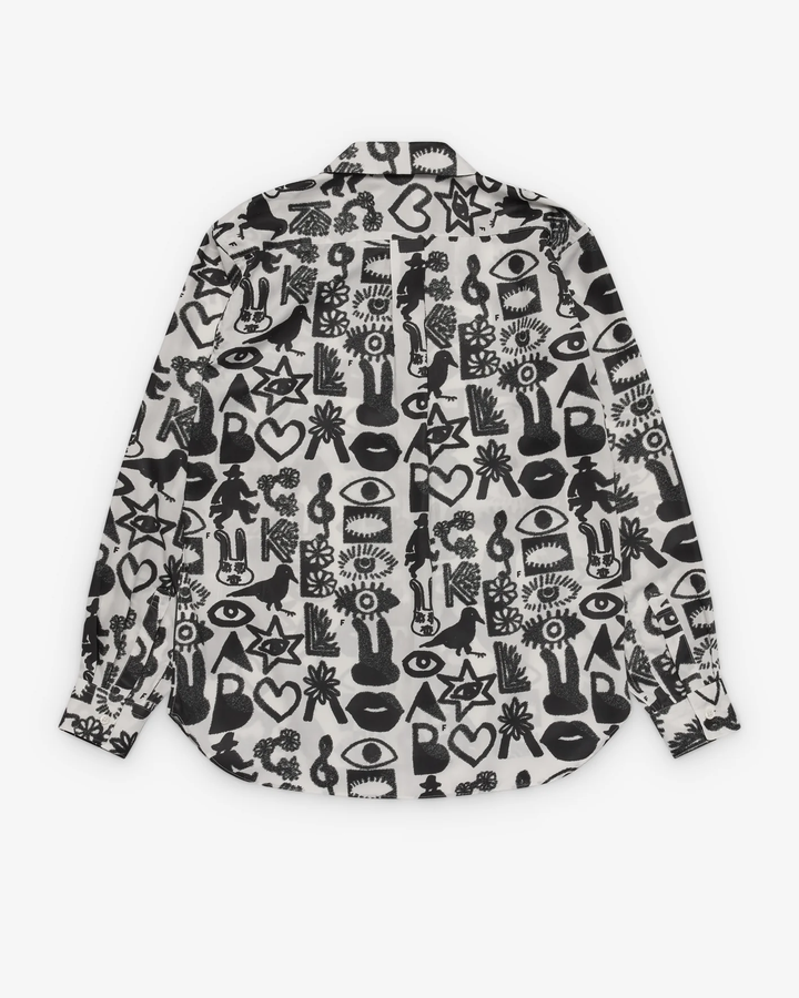 Comme des Garçons BLACK Filip Pagowski all-over print long sleeve shirt in black and white with graphic motifs of eyes, lips, stars, and birds laid flat on white background